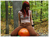 Debby plays with a balloon in the woods