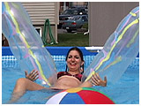 Video clip of Debby playing with worker balloons in the pool