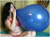 Video clip for sale of Heather blowing to burst 18-inch balloons