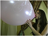 Video clip for sale of Andi blowing to pop Balloon Directory balloons