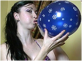 Video clip for sale of Eira blowing to burst small balloons