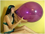 Video clip for sale of Eira blowing to pop a pair of balloons