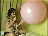 Video clip for sale of Rey Rey attempting to blow-to-burst a 20-inch balloon using a clear tube