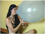 Video clip for sale of Eira slowly blowing to pop a 17-inch balloon