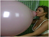 Video clip for sale of Rey Rey blowing to pop a pink 20-inch balloon