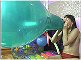 Video clip for sale of Debby taking on the challenge of blowing to pop a 28-inch crystal balloon