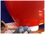 Alice inflates an enormous 72-inch balloon