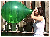 Video clip for sale of Alice blowing to burst a balloon full of confetti