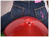 Video clip of Alice bum-popping balloons in her tight jeans