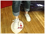 Video clip of Lizzie foot-popping balloons in her keds and rolled-up jeans