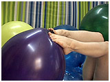 french pedicured feet playing with balloons