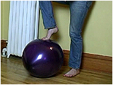 Video clip for sale of Xev foot popping balloons in jeans and bare feet