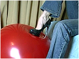 Video clip for sale of Eira popping balloons with spiked heels