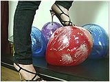 Video clip for sale of Lily heel-popping fireworks balloons with her steel-heeled shoes
