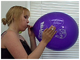 Xev inflates a Balloon Directory balloon while smoking a cigarette