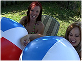Video clip for sale of Holly and Raven blowing up 36-inch beachballs in the backyard
