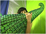 Video clip for sale of Heather blowing up a big inflatable pearly frost alligator by mouth