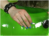 Video clip for sale of Nicky using her lit cigarette to slowly pop and deflate a big neon swim ring