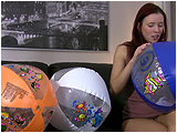 Video clip for sale of Holly blowing up beachballs