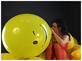 Video clip for sale of Mina over-inflates a 17-inch balloon until it pops