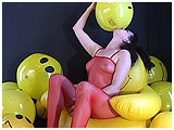 Video clip for sale of Mina with some smiley face beachballs